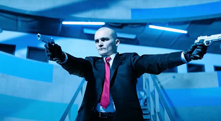 He’s bald, and he has guns.... he’s hired!